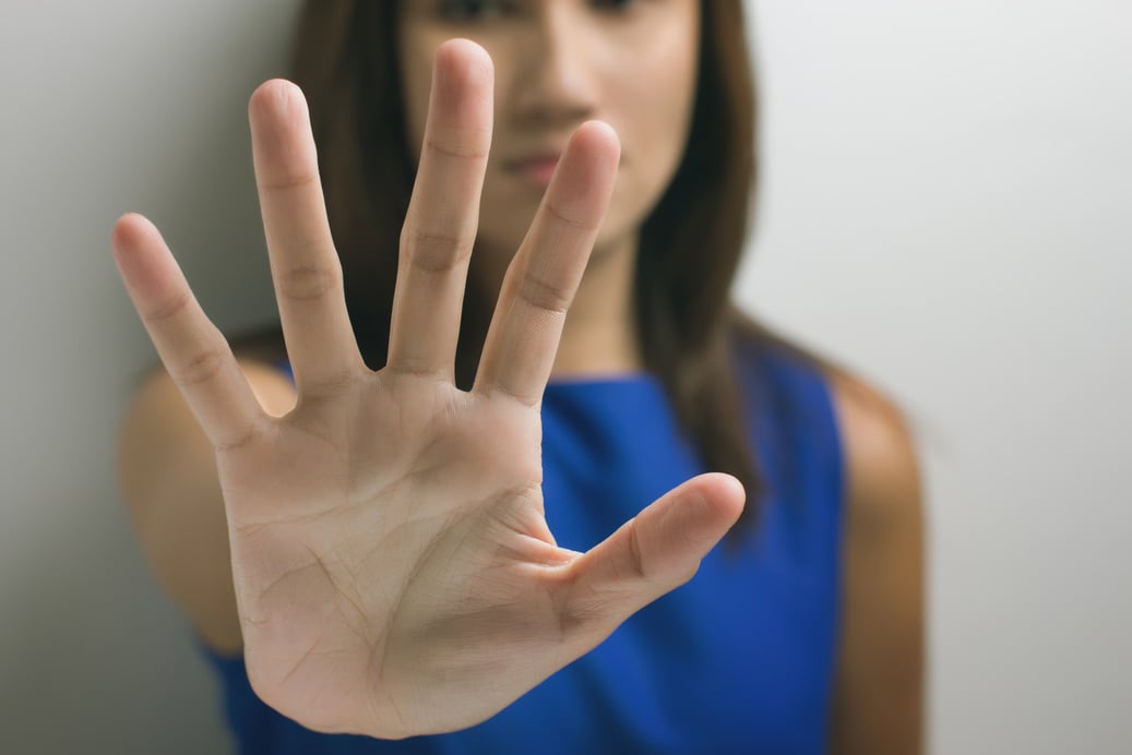 young woman showing her denial with NO on her hand